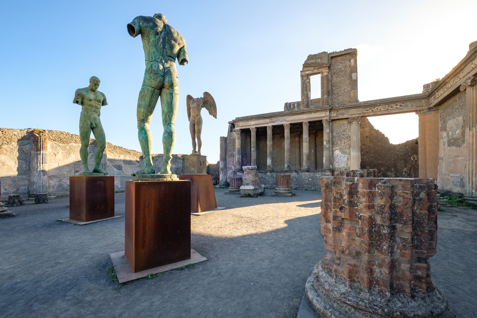 Scenic view of ruins and statues in ancient city of Pompeii